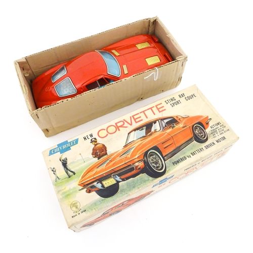 825 - Toy: A 20thC boxed Ichida scale model tinplate battery powered red Chevrolet Corvette Sting Ray Spor... 