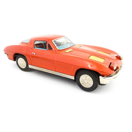 825 - Toy: A 20thC boxed Ichida scale model tinplate battery powered red Chevrolet Corvette Sting Ray Spor... 