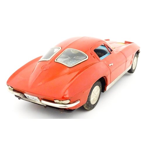 825 - Toy: A 20thC boxed Ichida scale model tinplate battery powered red Chevrolet Corvette Sting Ray Spor... 