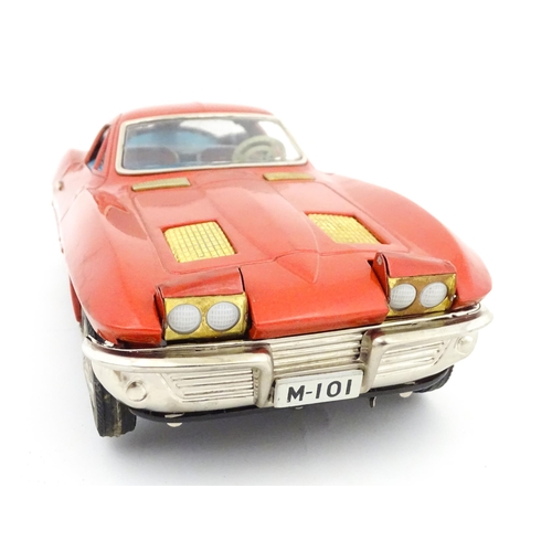 825 - Toy: A 20thC boxed Ichida scale model tinplate battery powered red Chevrolet Corvette Sting Ray Spor... 