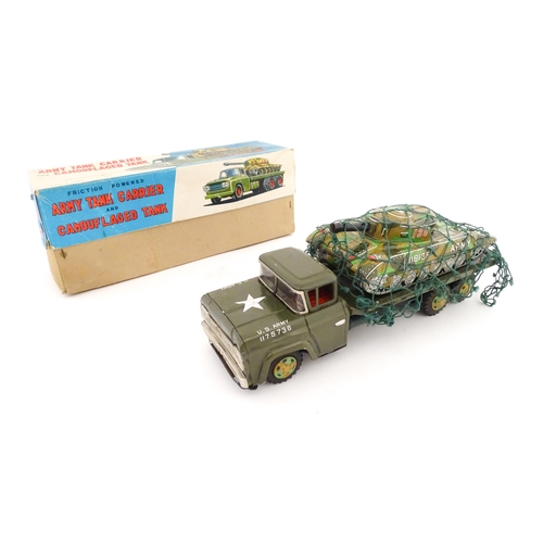 827 - A 20thC boxed scale model tinplate friction powered Army Tank Carrier and Camouflaged Tank. Made in ... 