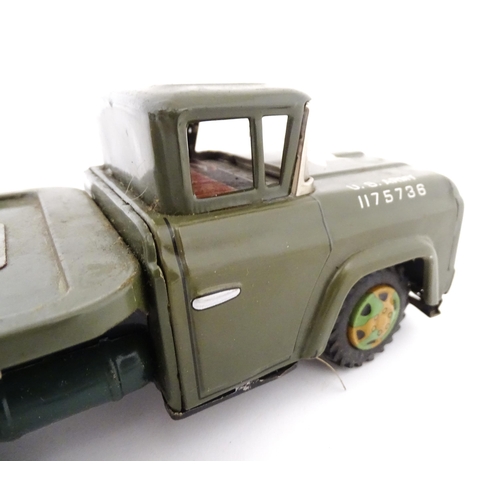 827 - A 20thC boxed scale model tinplate friction powered Army Tank Carrier and Camouflaged Tank. Made in ... 