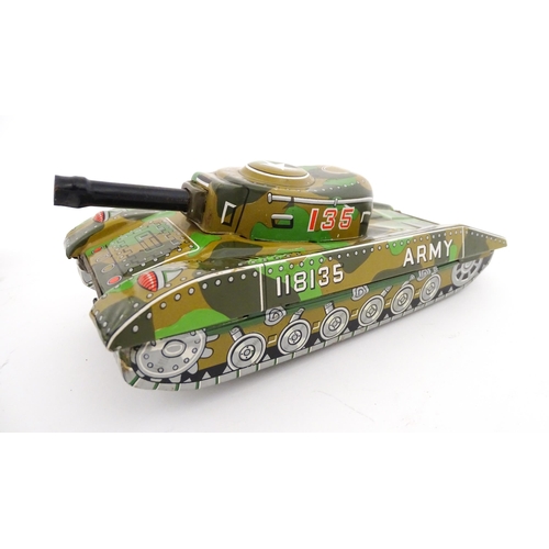 827 - A 20thC boxed scale model tinplate friction powered Army Tank Carrier and Camouflaged Tank. Made in ... 