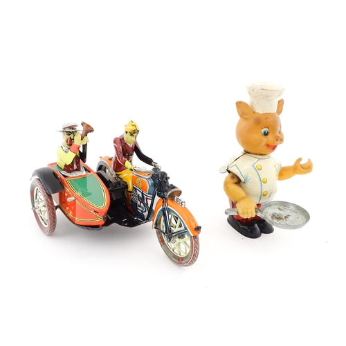 831 - Toys: Two 20thC tinplate clockwork toys to include a motorbike and sidecar, and a Japanese tinplate ... 