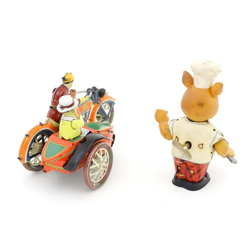 831 - Toys: Two 20thC tinplate clockwork toys to include a motorbike and sidecar, and a Japanese tinplate ... 