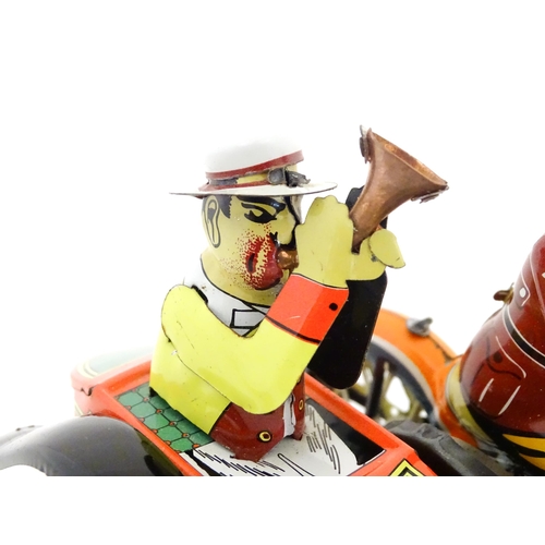 831 - Toys: Two 20thC tinplate clockwork toys to include a motorbike and sidecar, and a Japanese tinplate ... 