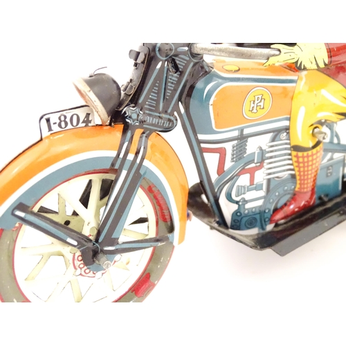 831 - Toys: Two 20thC tinplate clockwork toys to include a motorbike and sidecar, and a Japanese tinplate ... 