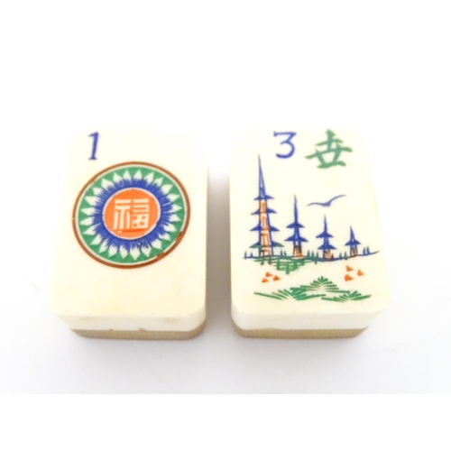 833 - Toys: A 20thC Chinese bone and bamboo Mahjong set within a leather case with five lift out trays. To... 