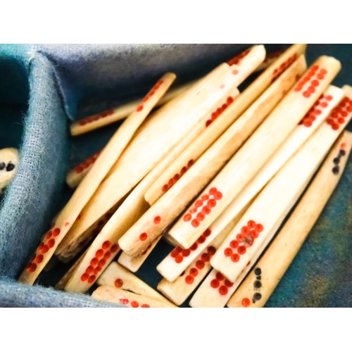 833 - Toys: A 20thC Chinese bone and bamboo Mahjong set within a leather case with five lift out trays. To... 