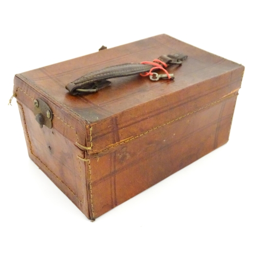 833 - Toys: A 20thC Chinese bone and bamboo Mahjong set within a leather case with five lift out trays. To... 