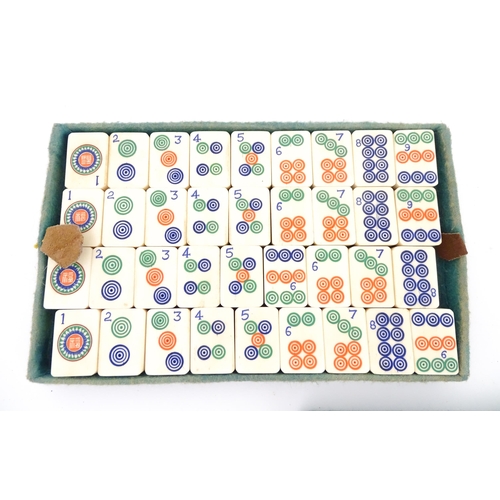 833 - Toys: A 20thC Chinese bone and bamboo Mahjong set within a leather case with five lift out trays. To... 