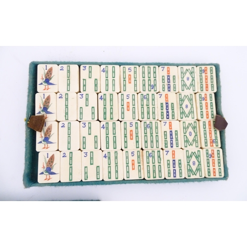 833 - Toys: A 20thC Chinese bone and bamboo Mahjong set within a leather case with five lift out trays. To... 