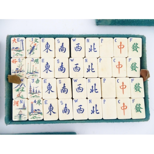 833 - Toys: A 20thC Chinese bone and bamboo Mahjong set within a leather case with five lift out trays. To... 