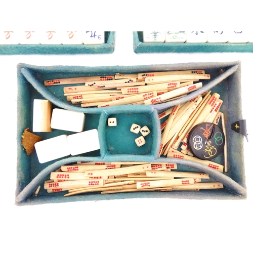 833 - Toys: A 20thC Chinese bone and bamboo Mahjong set within a leather case with five lift out trays. To... 