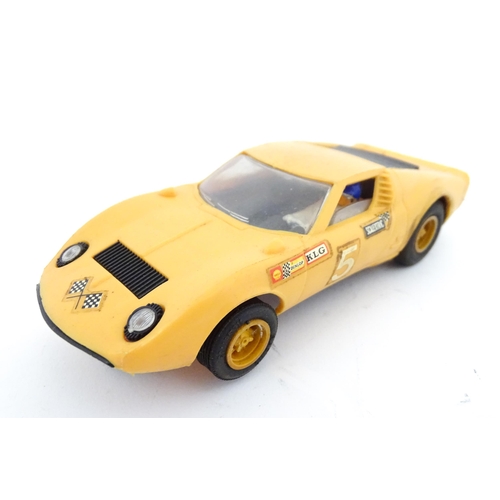 847 - Toys: Three assorted scale model vehicles to include a boxed Scalextric C9 Ferrari GP race car in ye... 