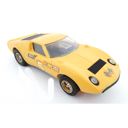 847 - Toys: Three assorted scale model vehicles to include a boxed Scalextric C9 Ferrari GP race car in ye... 