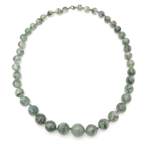 707 - A moss agate bead necklace. Approx. 22