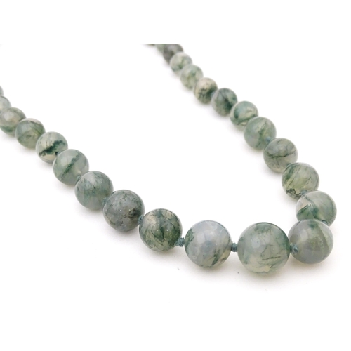 707 - A moss agate bead necklace. Approx. 22