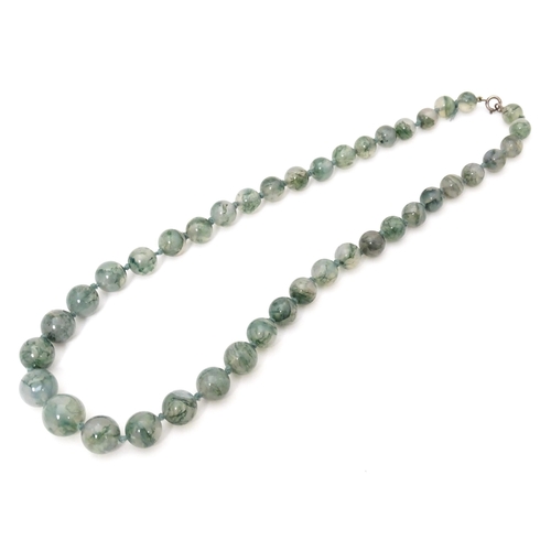 707 - A moss agate bead necklace. Approx. 22