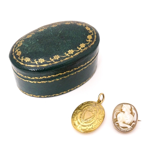 708 - A Classical shell carved cameo within a yellow metal surround. Together with a locket formed pendant... 