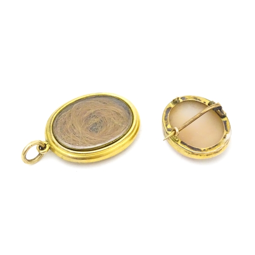 708 - A Classical shell carved cameo within a yellow metal surround. Together with a locket formed pendant... 