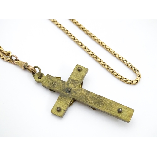 710 - Six assorted cross / cruciform pendants on chains, to include some silver examples. Largest pendant ... 