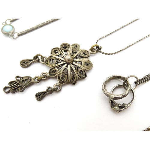 723 - Assorted jewellery to include silver chains, pendants, yellow metal bow formed brooch with garnet ca... 