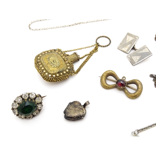 723 - Assorted jewellery to include silver chains, pendants, yellow metal bow formed brooch with garnet ca... 