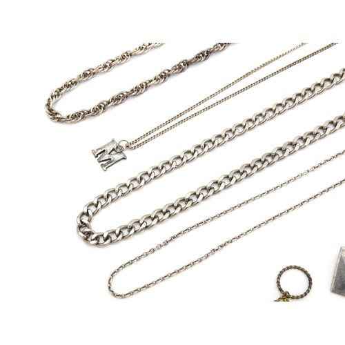 723 - Assorted jewellery to include silver chains, pendants, yellow metal bow formed brooch with garnet ca... 