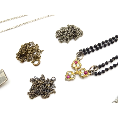 723 - Assorted jewellery to include silver chains, pendants, yellow metal bow formed brooch with garnet ca... 