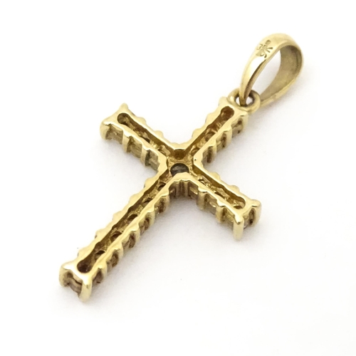 735 - A 9ct gold cross form pendant set with diamonds. Approx. 1