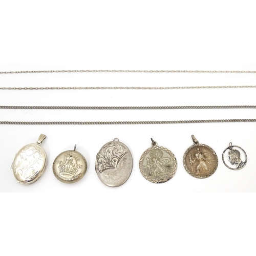 740 - A quantity of assorted silver and white metal pendants and chains to include lockets, St Christopher... 