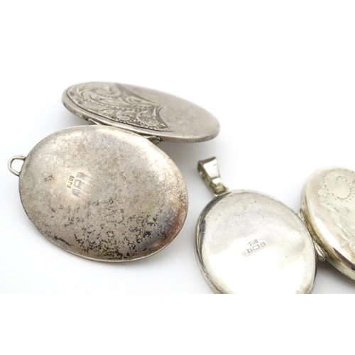 740 - A quantity of assorted silver and white metal pendants and chains to include lockets, St Christopher... 