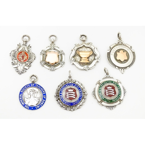 750 - Seven assorted hallmarked silver trophy fobs to include examples for Portland Cricket Club, Paddingt... 