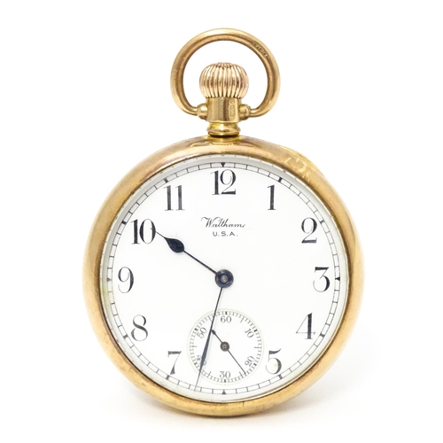 754 - A Waltham USA 9ct gold cased open face pocket watch, the white enamel dial with Arabic numerals and ... 