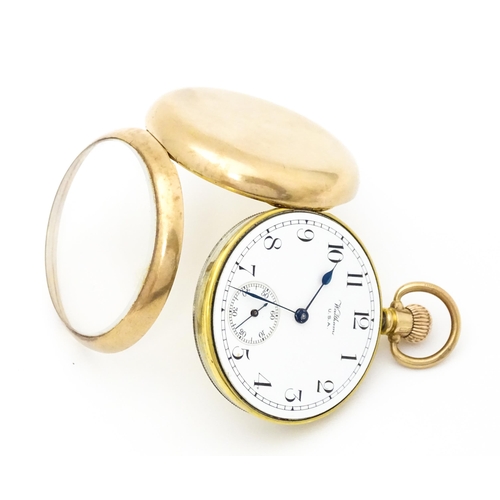 754 - A Waltham USA 9ct gold cased open face pocket watch, the white enamel dial with Arabic numerals and ... 