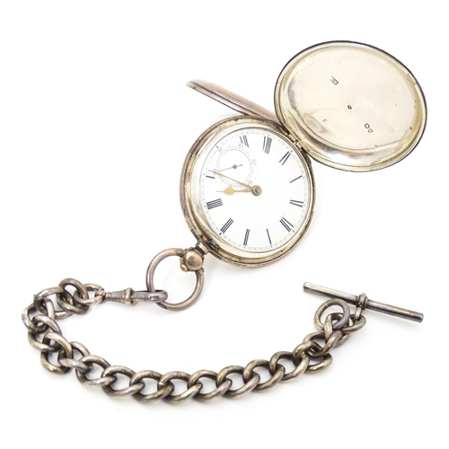 756 - A Victorian silver hunter pocket watch, the white enamel dial with Roman numerals and subsidiary sec... 