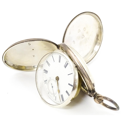 756 - A Victorian silver hunter pocket watch, the white enamel dial with Roman numerals and subsidiary sec... 