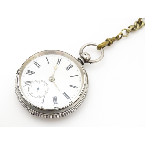 757 - A silver pocket watch with white enamel dial with Roman numerals and subsidiary seconds dial. The ca... 