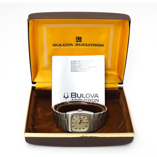 770 - A 1970's Bulova Accutron wrist watch with Bulova watch box and guide. The dial approx 1