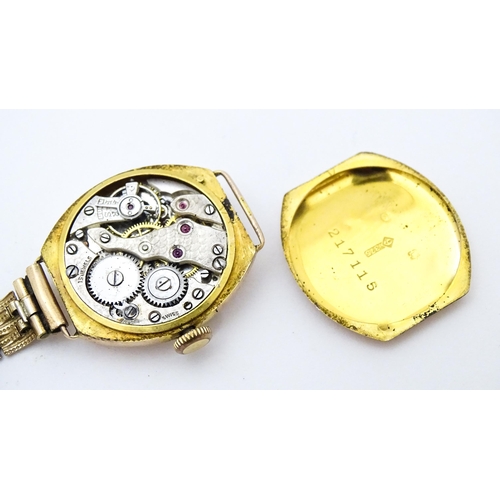 771 - Two ladies 9ct gold cased wristwatches. Together with a 9ct gold watch strap (3)