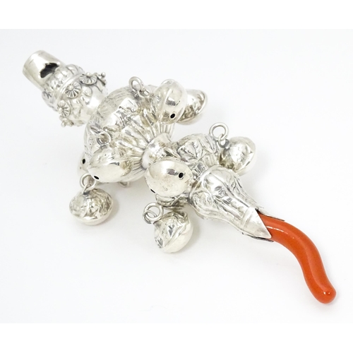 502A - A .925 silver baby's rattle with ten bells and coral branch. Approx 5