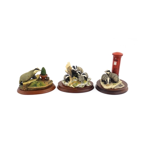 912 - Three Border Fine Arts model badgers comprising Urban Badgers L151, Garden Intruder A1874, and Eveni... 