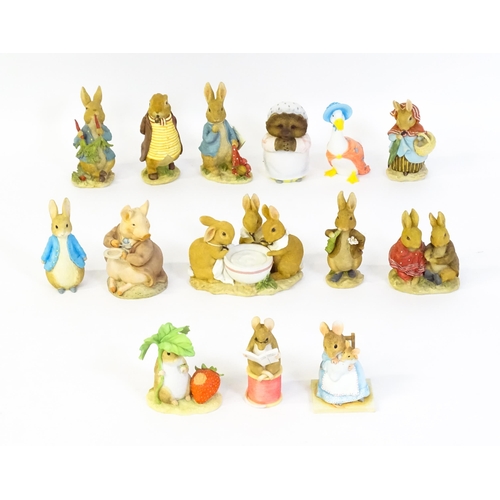 932 - A quantity of Border Fine Arts Beatrix Potter figures to include Peter Rabbit eating Radishes A1932,... 