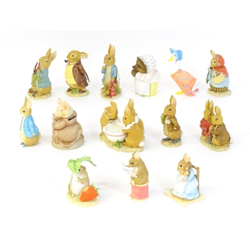 932 - A quantity of Border Fine Arts Beatrix Potter figures to include Peter Rabbit eating Radishes A1932,... 