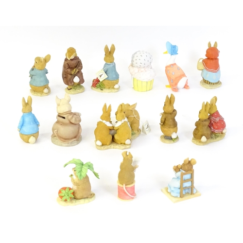 932 - A quantity of Border Fine Arts Beatrix Potter figures to include Peter Rabbit eating Radishes A1932,... 