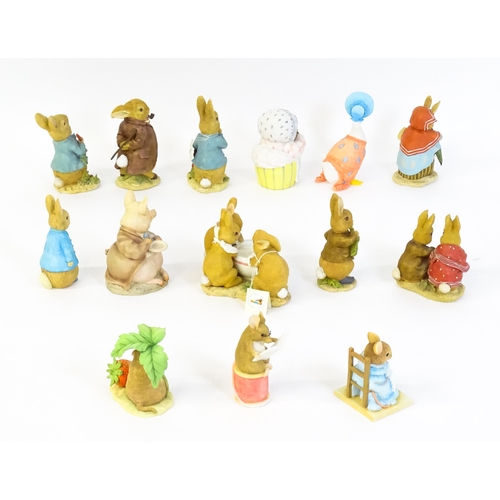 932 - A quantity of Border Fine Arts Beatrix Potter figures to include Peter Rabbit eating Radishes A1932,... 