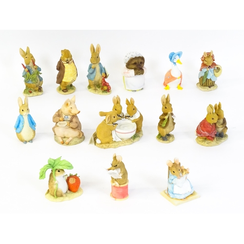 932 - A quantity of Border Fine Arts Beatrix Potter figures to include Peter Rabbit eating Radishes A1932,... 