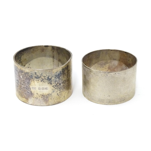 335 - A silver napkin ring hallmarked Sheffield 1928, maker Atkin Brothers. Together with another having e... 