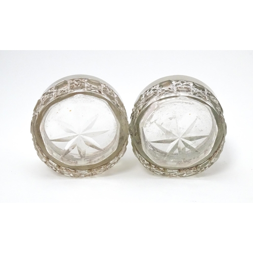 338 - A pair of cut glass salts with silver rims, hallmarked Birmingham 1901, maker Synyer & Beddows. Appr... 